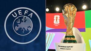 Escudo de la UEFA junto al trofeo de la Copa del Mundo de la FIFA sobre su pedestal en un sorteo